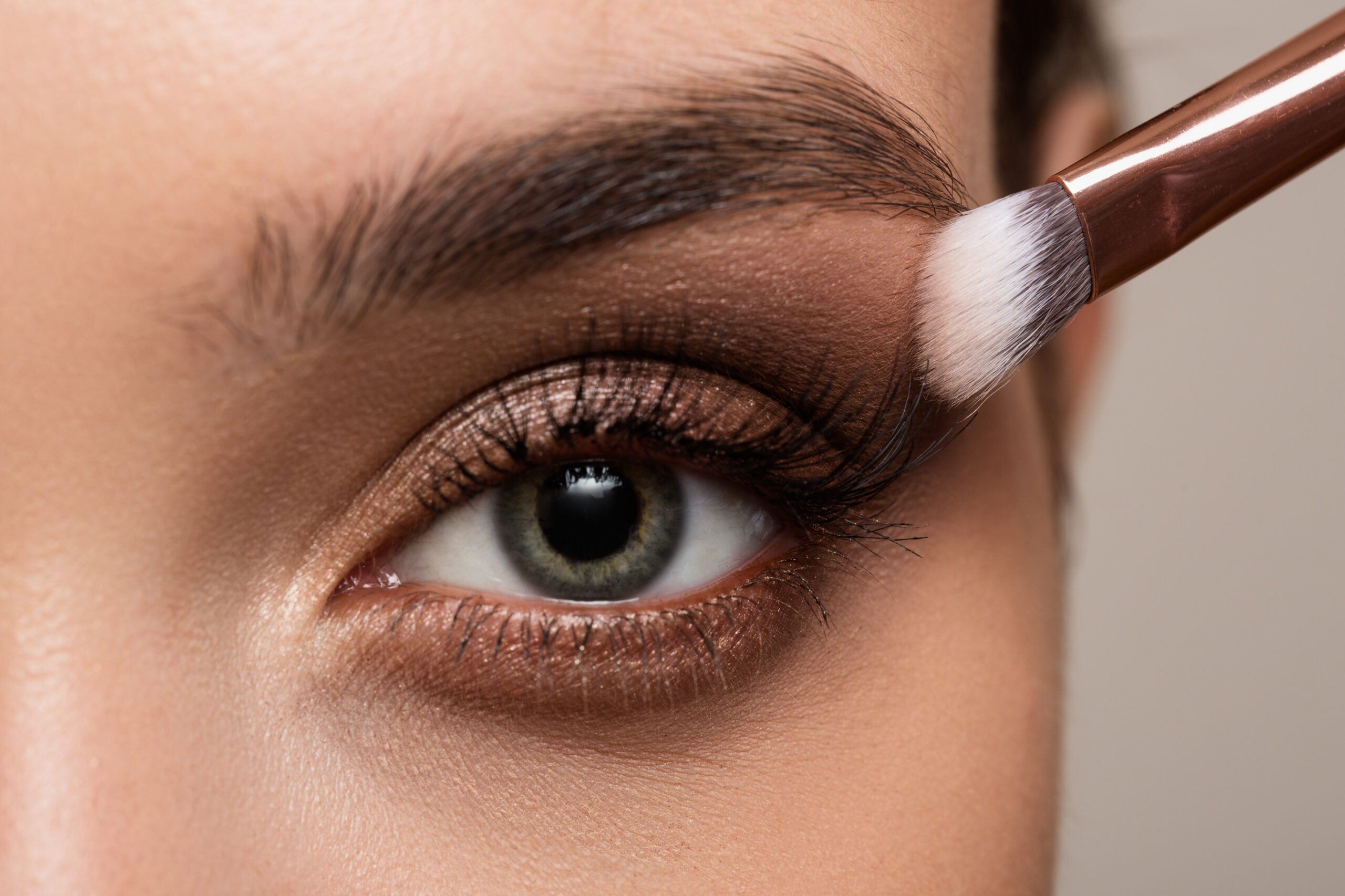 applying eyeshadow with brush