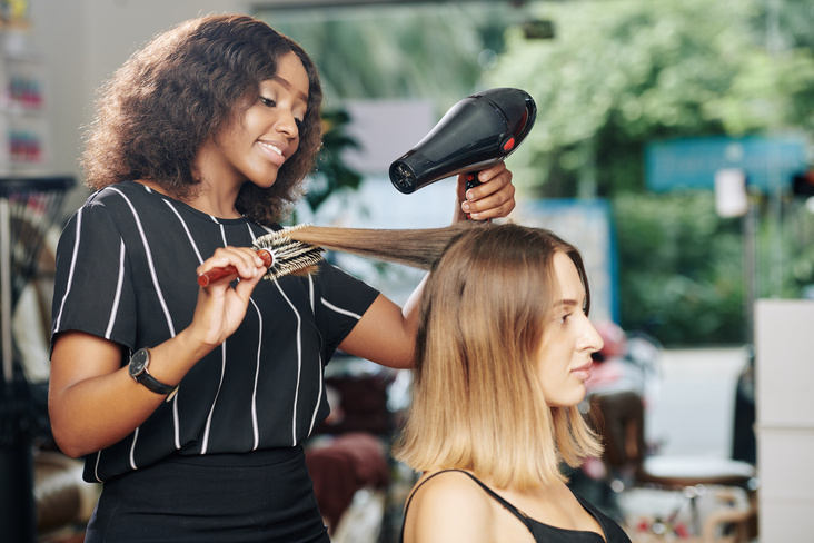 hairstylist drying hair