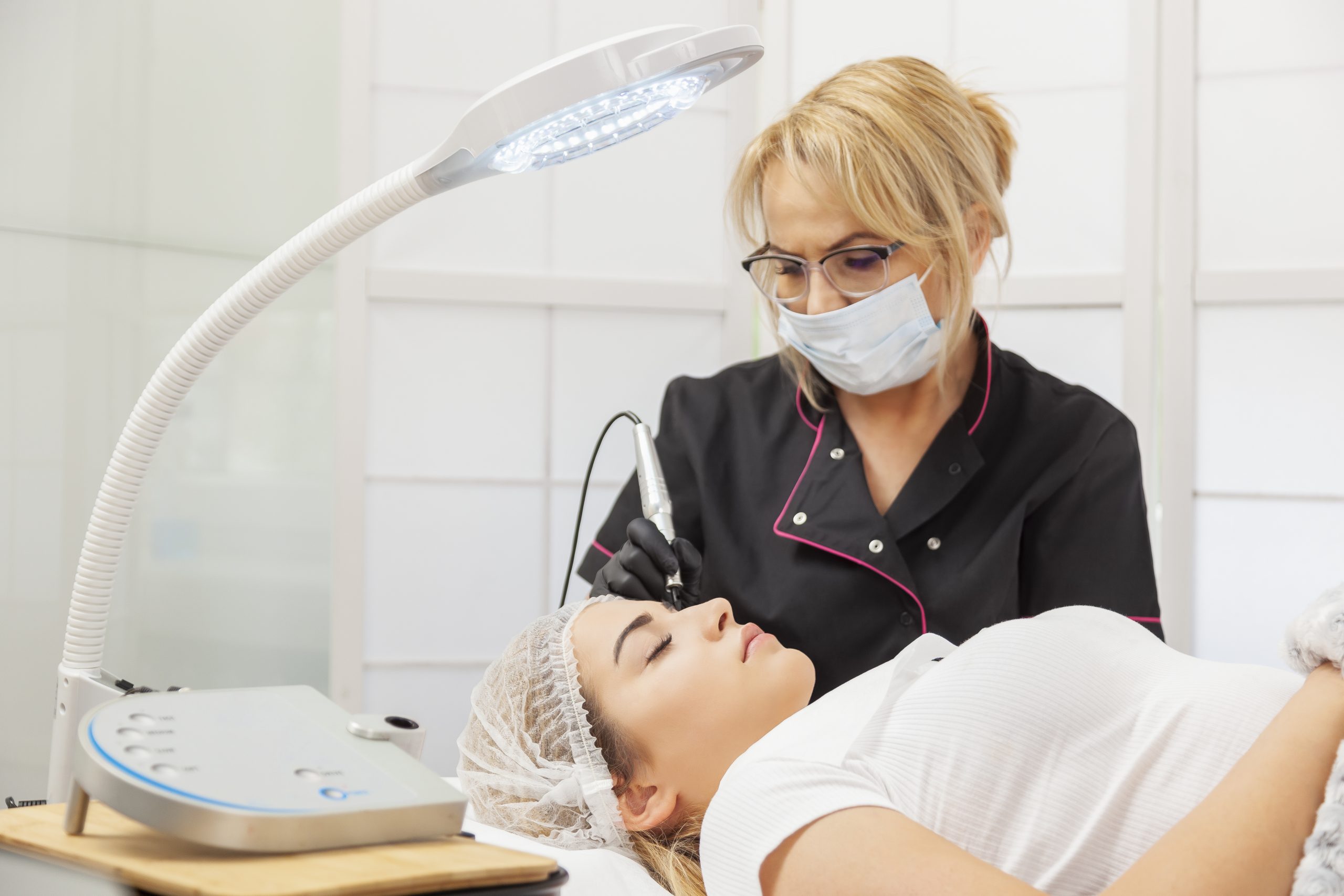 Esthetician working on client